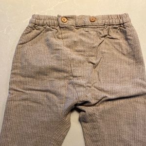 Striped pants with wood buttons